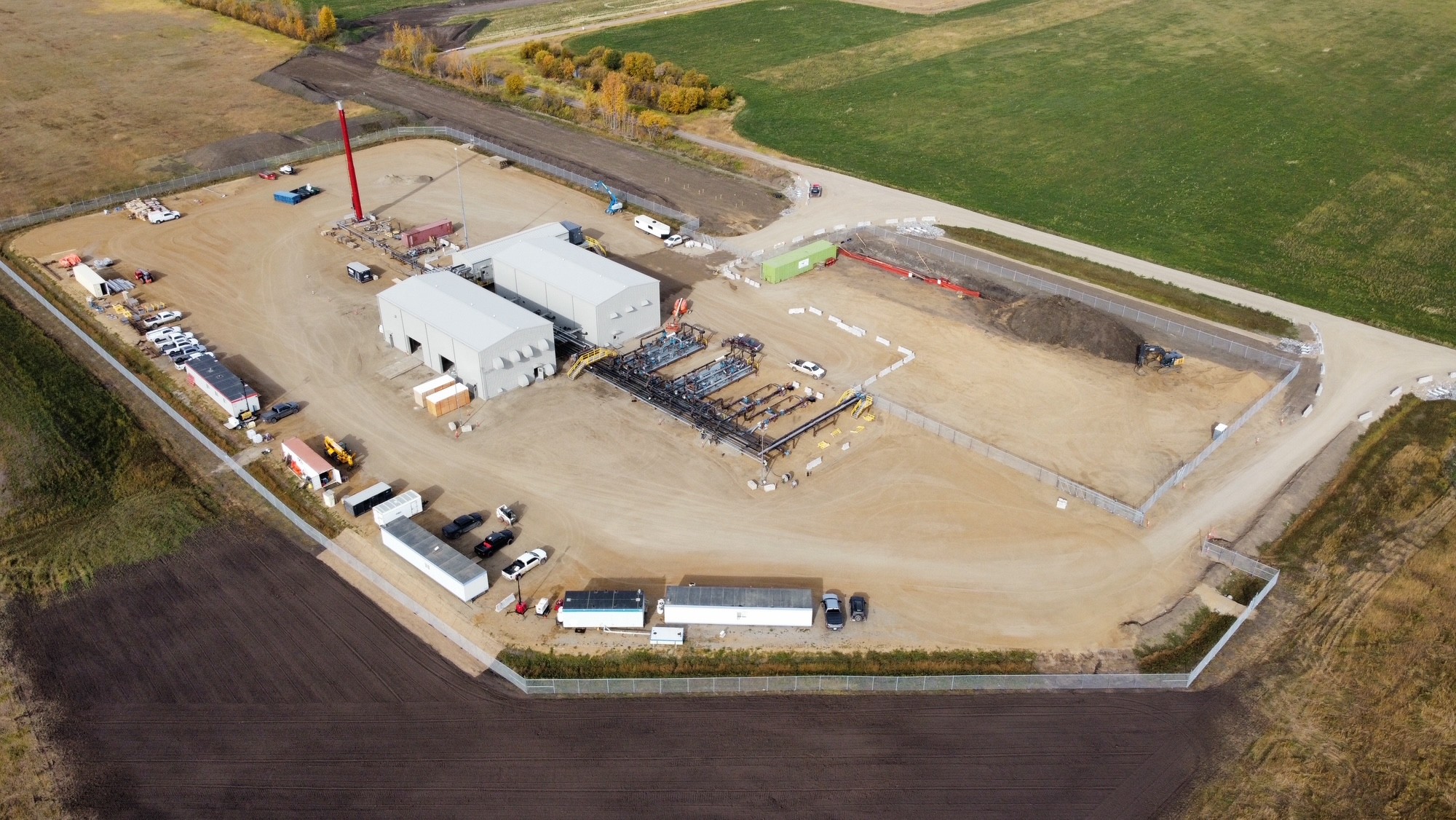 Aerial view of the Three-Pump Pipeline Expansion pump station site in Northwestern Alberta with Makloc rigid frame steel buildings